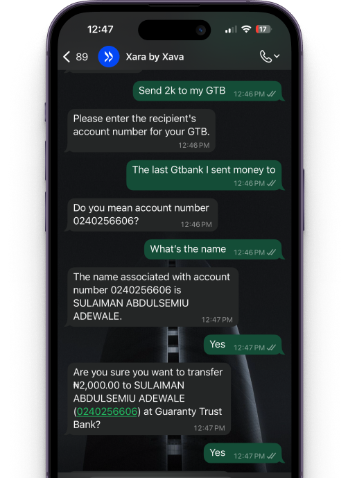 Image of a user using a phone to transfer money using Xara whatapp chat